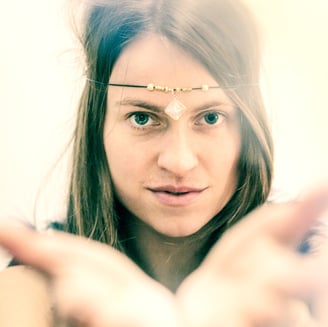 a woman with jelevery and a nose ring