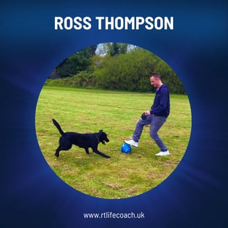 Ross Thompson Mindset Coach playing with his dog in a field.