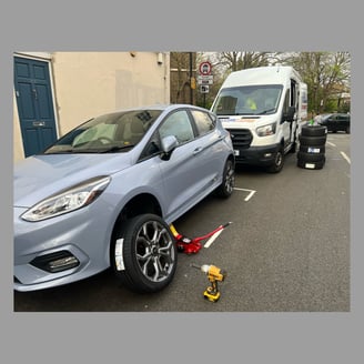 a car tyre got changed at roadside by mobile tyre fitting unit