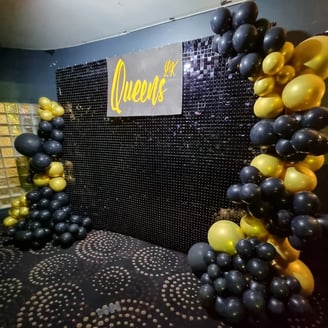 Black shimmer wall with balloon garland for the happening night club in Brisbane.