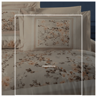 a bed with a floral print on it