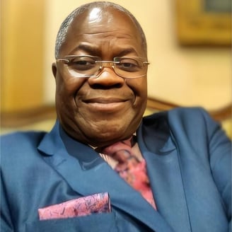 a man in a suit and tie smiling