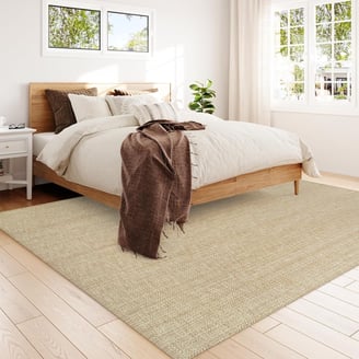 a bedroom with a bed and a bed in the middle of a room