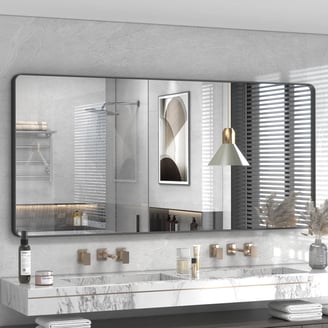 a bathroom with a marbled vanity and a mirror