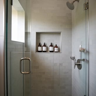 a bathroom with a shower and a shower