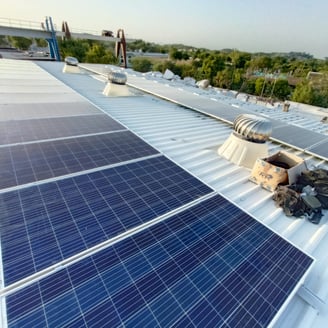 a solar paneled roof with solar panels on a metal roof