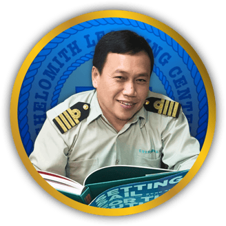 Photo of Mr. Reno A. Ewican on a circle gold frame with Shelomith Learning Center Logo background.