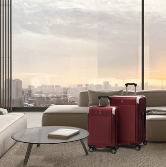 a living room with a couch and luggage