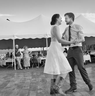 a bride and groom dancing in the outdoor wedding
