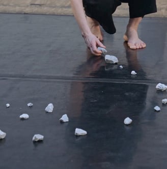 dancer moving stone