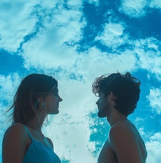 a man and woman standing in front of a blue sky