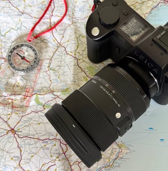 Leica SL2, compass and map of Spain