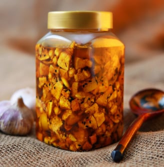 a jar of pickled garlic garlic oil