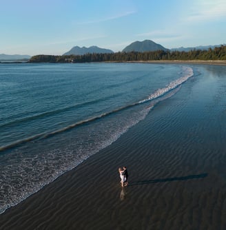 Couple eloping on Chesterman beach in Tofino, British Columbia.