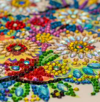 a close up of a colorful embroided rhinestone on a table