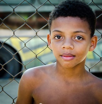 a young boy with a banana peel on his hand
