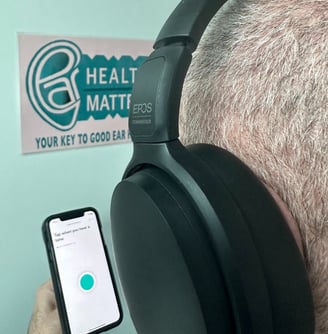 A man doing an online hearing test