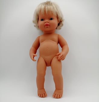 Miniland doll with blonde hair standing