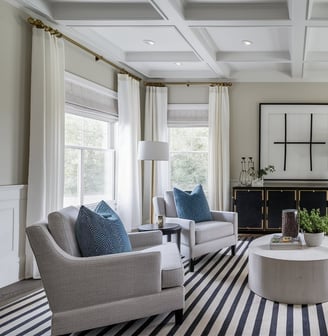 a living room with a striped rug and a striped rug