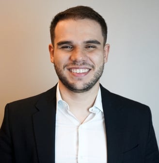 a man in a suit and white shirt