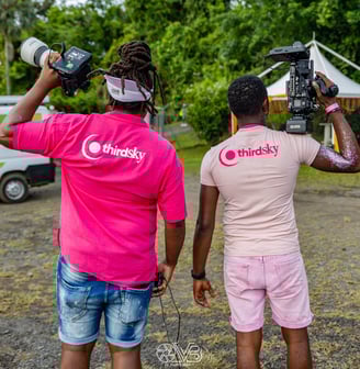 two men standing with camera