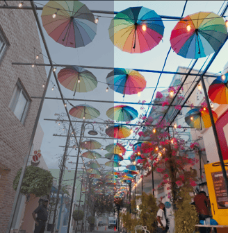 a bunch of umbrellas hanging from a ceiling