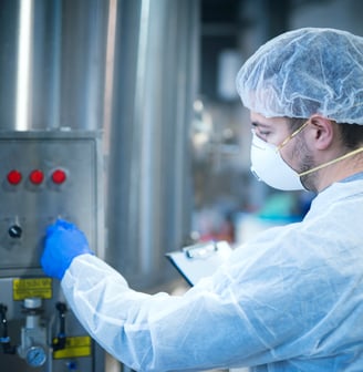 a man in a lab coat and a mask on