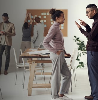 a man and woman standing in a room