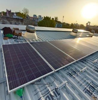 a solar paneled roof with solar panels on a roof