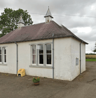 a small white village community hall