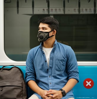 a man wearing a mask and a mask on his face