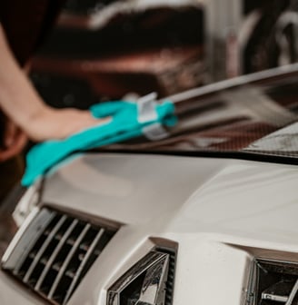 Exterior car detailing with hand wash, wheel and tire care, wax application, bug removal