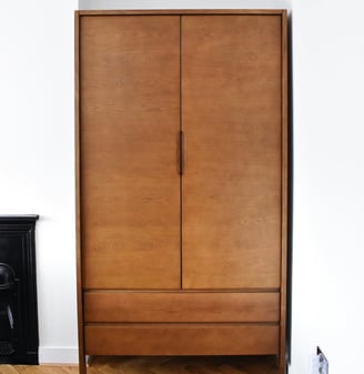 a wooden cabinet with a fireplace in a room