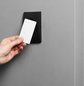 a person holding a business card in their hand