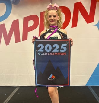 Baylor holding a 2025 championship banner