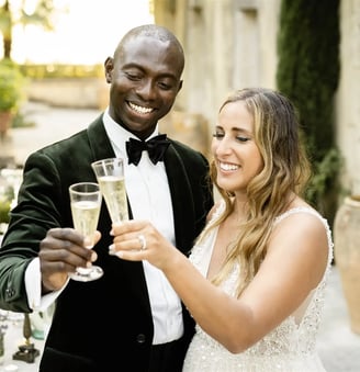 Elopement couple toasting with champagne at a luxury villa in Provence
