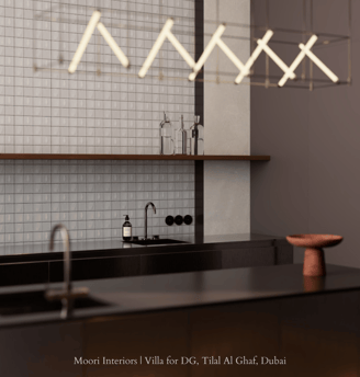 Contemporary kitchen design featuring a dark countertop and illuminated by a linear light fixture.