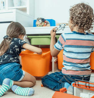 Two children learn through play.