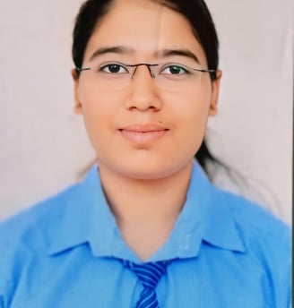 a woman in a blue shirt and tie dye dye dye dye dye dye dye dye