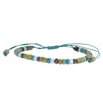 a beaded bracelet on turquoise string