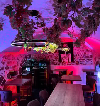 a restaurant with a large table and chairs