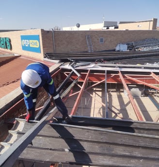 Environmental Pro Construction team replacing a roof structure on a commercial building in West Rand