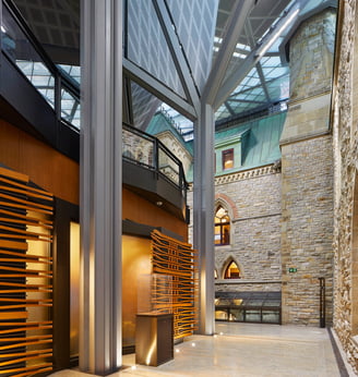 a large gallery with a stone walls and floors