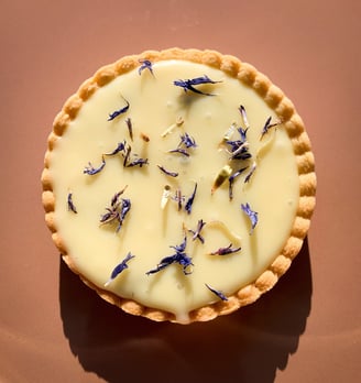 a pie with flowers on a plate