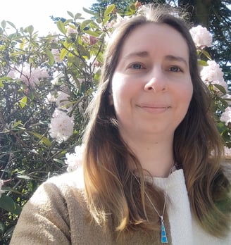 photo of author in front of flowering tree