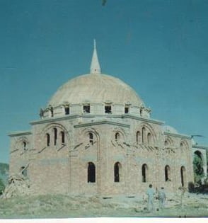 a large building with a dome shaped building on top of it