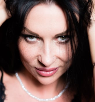 a woman with a necklace and a necklace