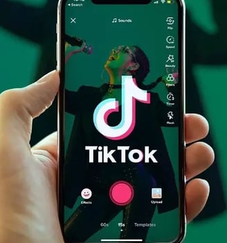 a person holding a phone with the tik tok