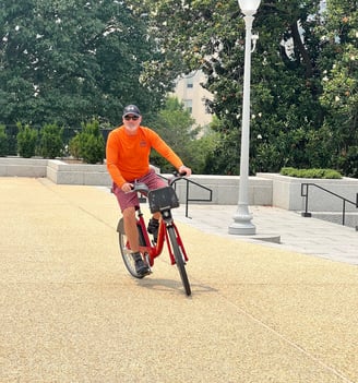 a man riding a bicycle in a park