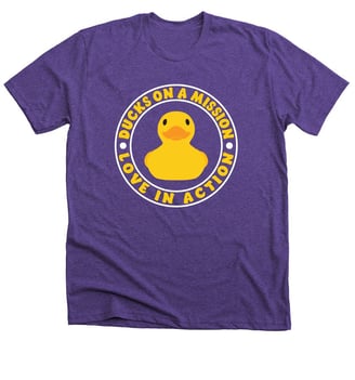 a purple t - shirt with a ducky in the middle of it